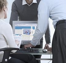 3persons working on computer, small